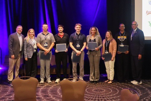 Cole Higgins (center) pictured with other NJCAA award winners.