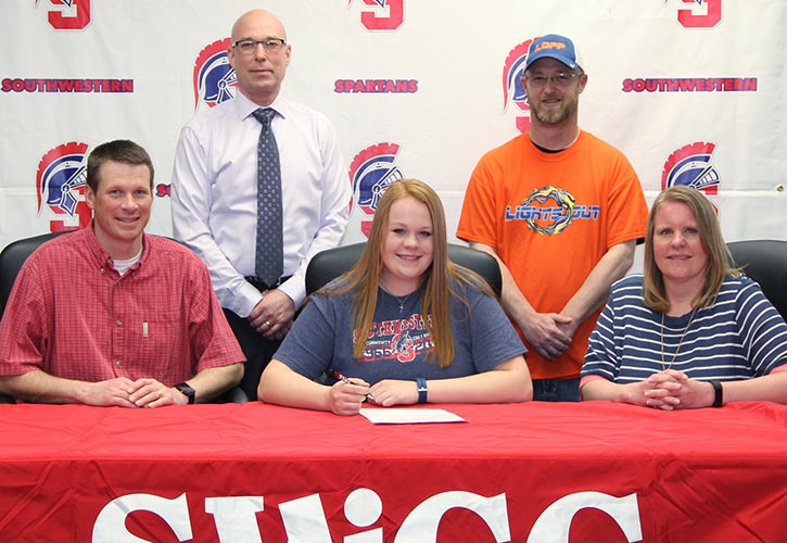 Pictured: Sitting (L to R) &ndash; Andy Tibbs, Kelsey&rsquo;s father; Kelsey Tibbs; and Amy Tibbs, Kelsey&rsquo;s mother. Standing &ndash; Bill Taylor, Southwestern vice president of instruction, and Andy Major, head coach for Lights Out Fast Pitch.