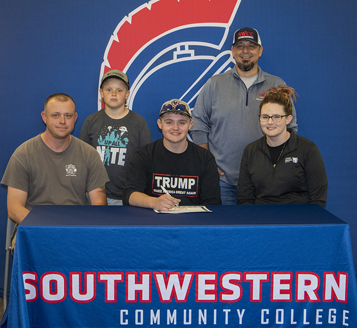Sitting: Jeff Werner, Logan's father; Logan Werner; and Kim Werner, Logan's mother.
Standing: Drake Werner, Logan's brother, and Josh Purdy, Southwestern head sports shooting coach.