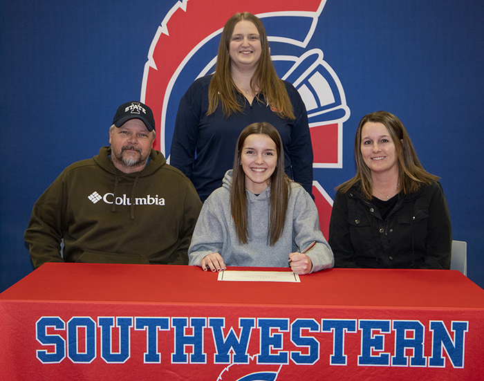 Sitting: Monty Chew, Jayda’s father; Jayda Chew; and Sherri Chew, Jayda’s mother. Standing: Taylor Shipley, Southwestern head volleyball coach. 